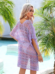 Lavender lace-knit kaftan with side tie detail and V-neck, worn over swimwear.