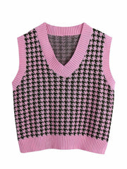 Houndstooth knit v-neck tank top in pink with black pattern.