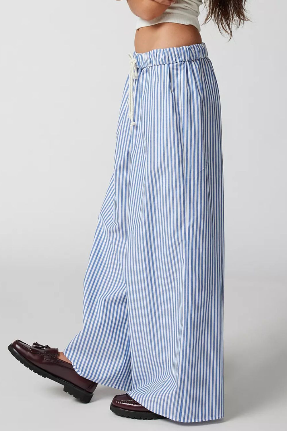Light blue and white striped wide-leg drawstring trousers with a relaxed fit.