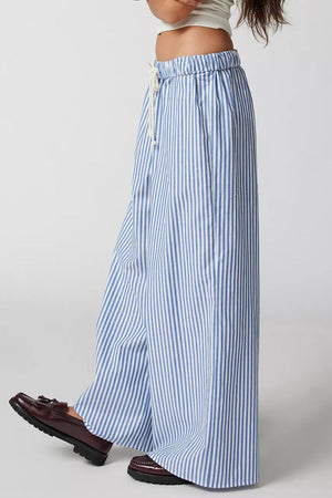 Light blue and white striped wide-leg drawstring trousers with a relaxed fit.