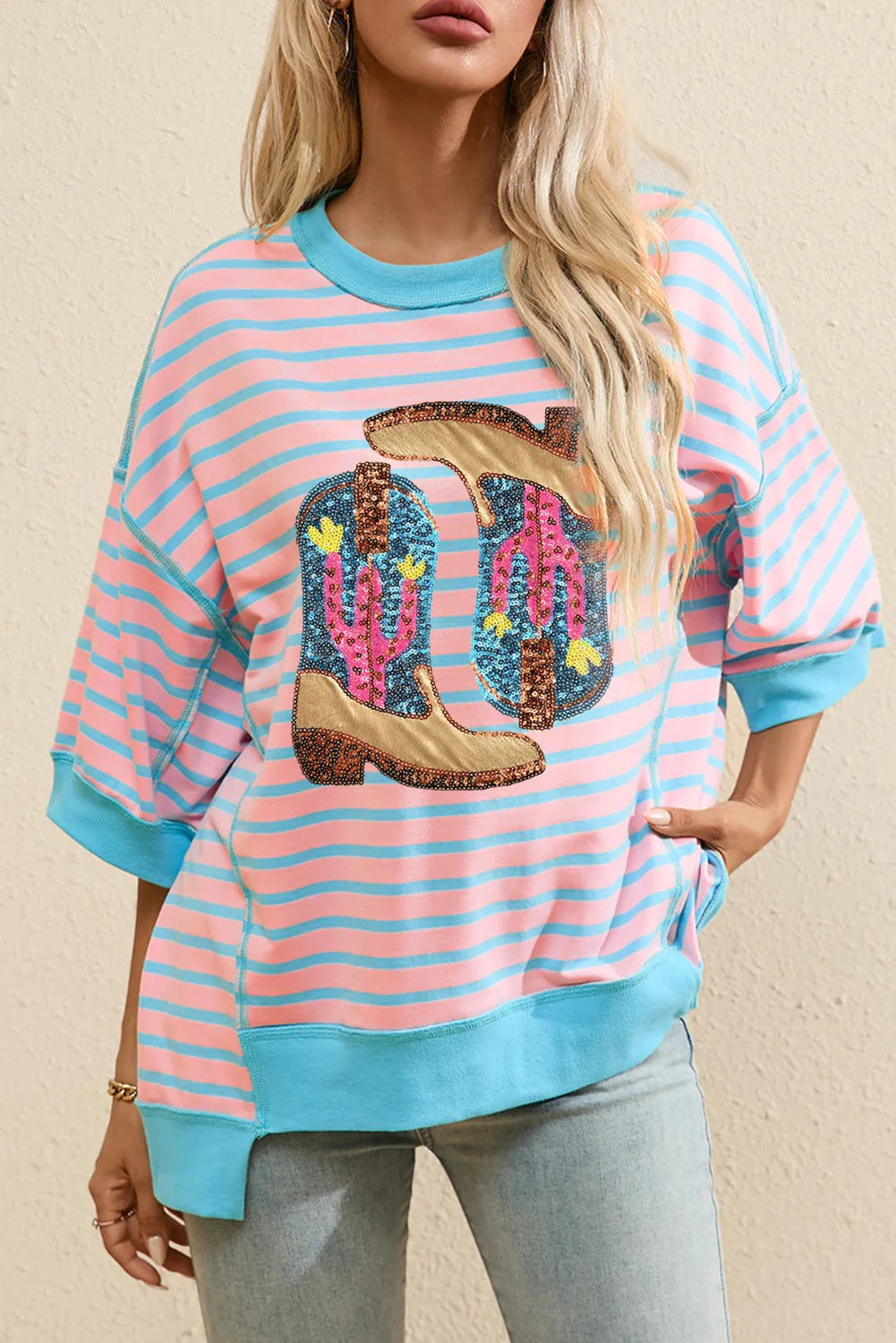 Blush pink and blue striped sweatshirt with sequin cowboy boot and cactus graphic.