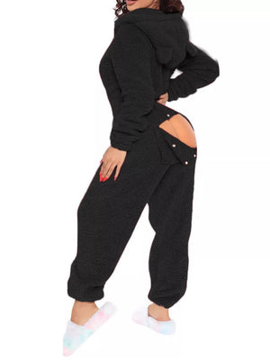 Black fleece hooded romper with open-back detail and button closure.