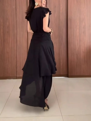 Black asymmetrical ruffle hem dress with cap sleeves and cinched waist.