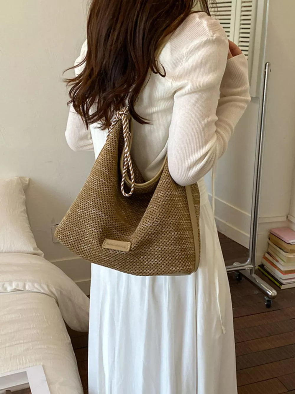 Tassel Woven Crossbody Bag in French Blue, model styling view