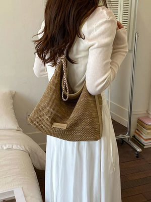 Tassel Woven Crossbody Bag in French Blue, model styling view