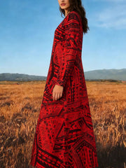 Red tribal print maxi dress with V-neck and long sleeves.