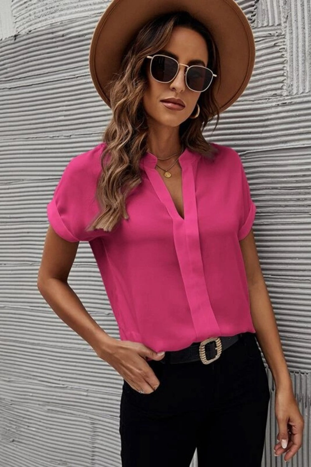 Hot Pink plunge front blouse with cuffed short sleeves and a V-neckline.