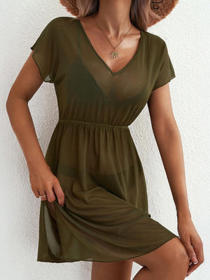 Green sheer mini dress with V-neck, short sleeves, elastic waist, and side slit.