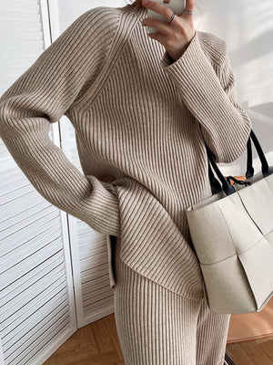 Asymmetric ribbed knit co-ord set in Dust Storm acrylic, long sleeve, high neck top and pants.