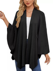 Black knit cape top with draped elegance and open front.