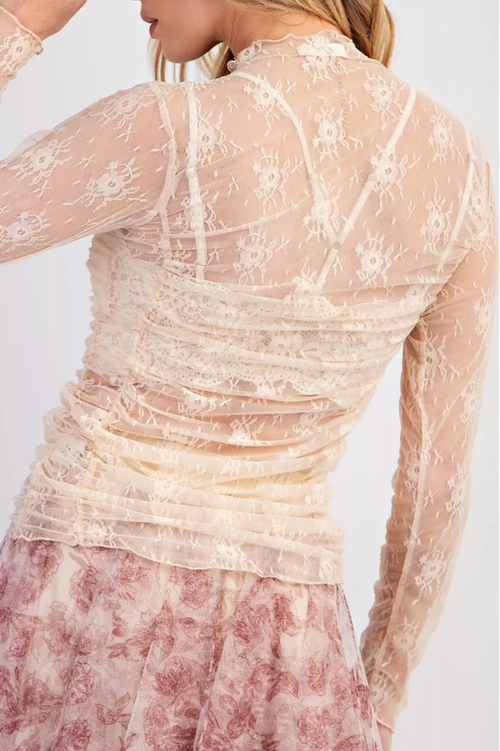 Delicate floral lace ruched maternity shirt with mock neck and long sleeves in cream.