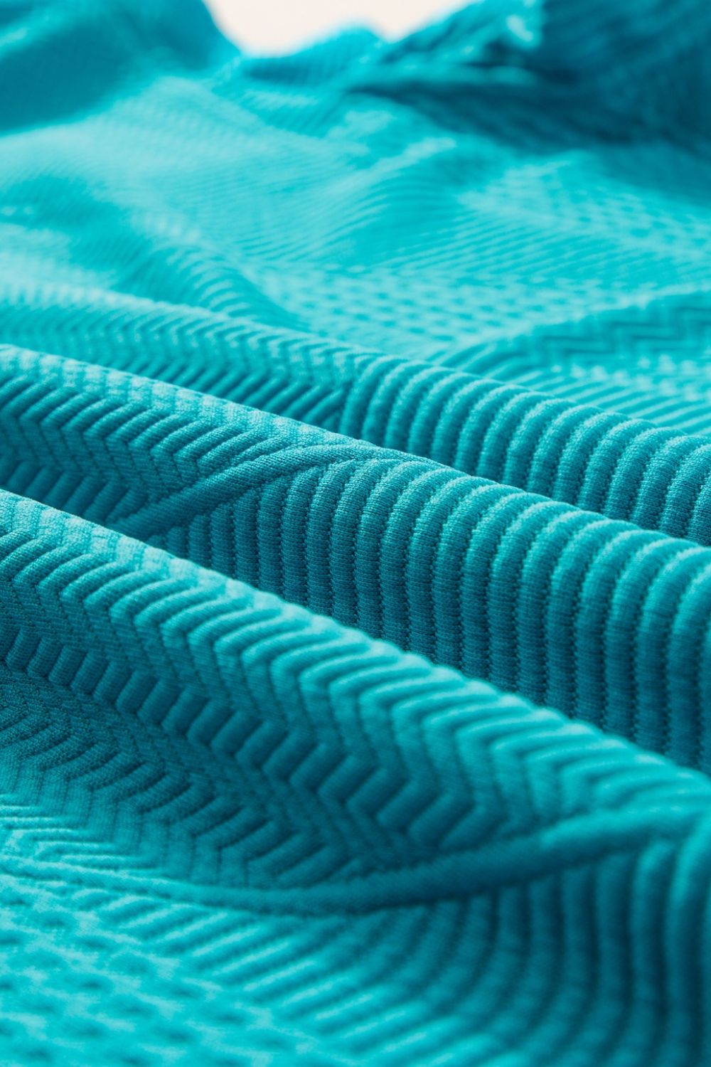 Turquoise textured co-ord short set fabric with chevron pattern detail
