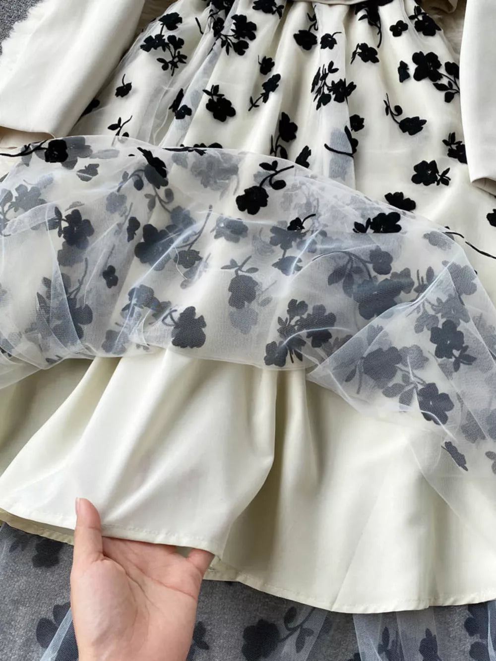 Maternity midi dress with sheer floral overlay and matching blazer.