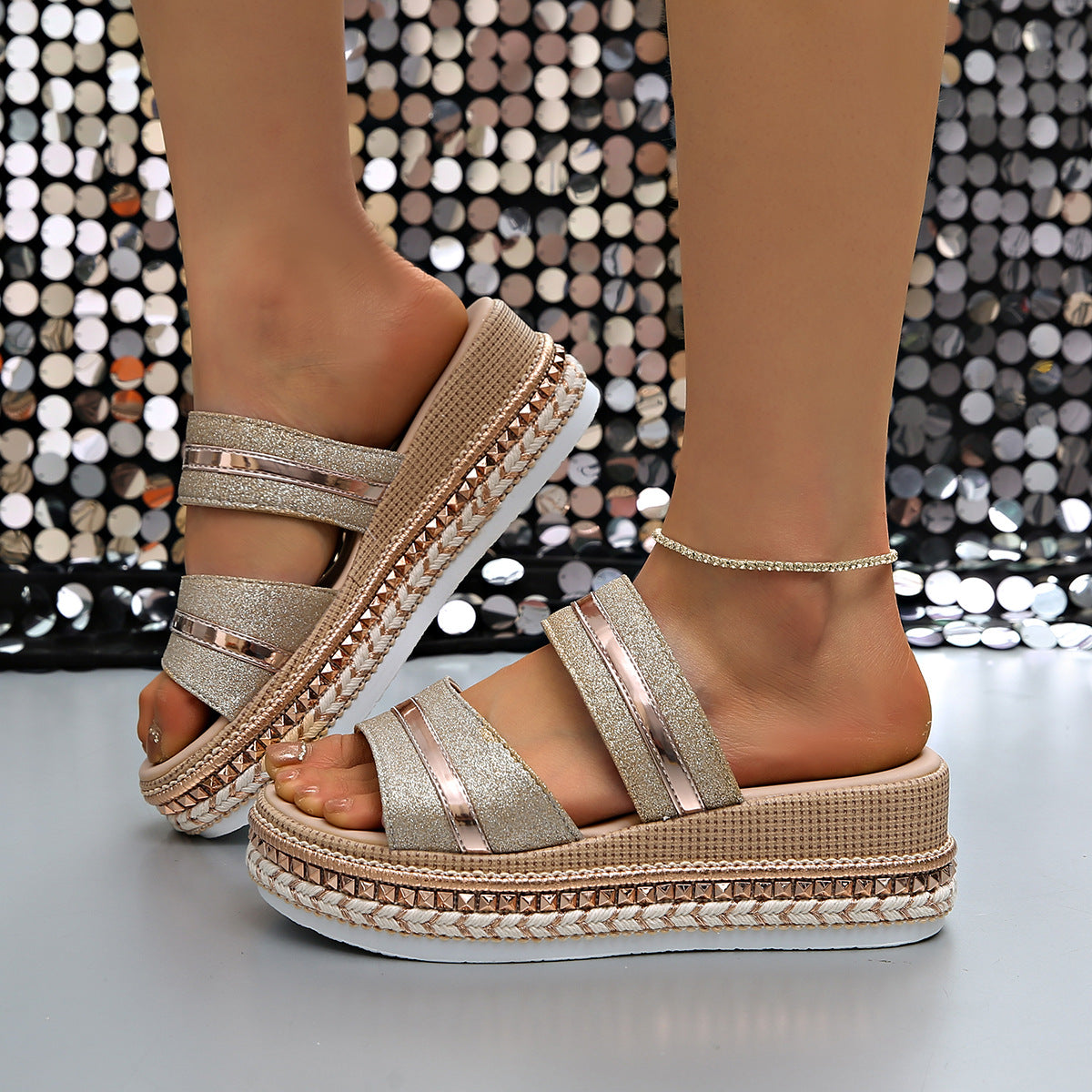 Glamorous wedge sandals with glitter straps and metallic accents, featuring a braided espadrille-style sole.