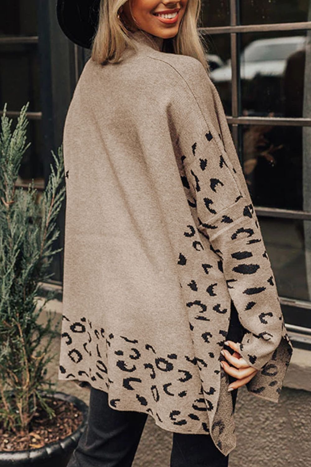 Khaki acrylic knit sweater with asymmetric leopard print panels and side slits.