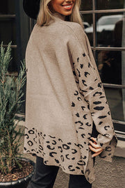 Khaki acrylic knit sweater with asymmetric leopard print panels and side slits.