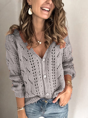 Gray chevron knit cardigan with openwork details and button front.