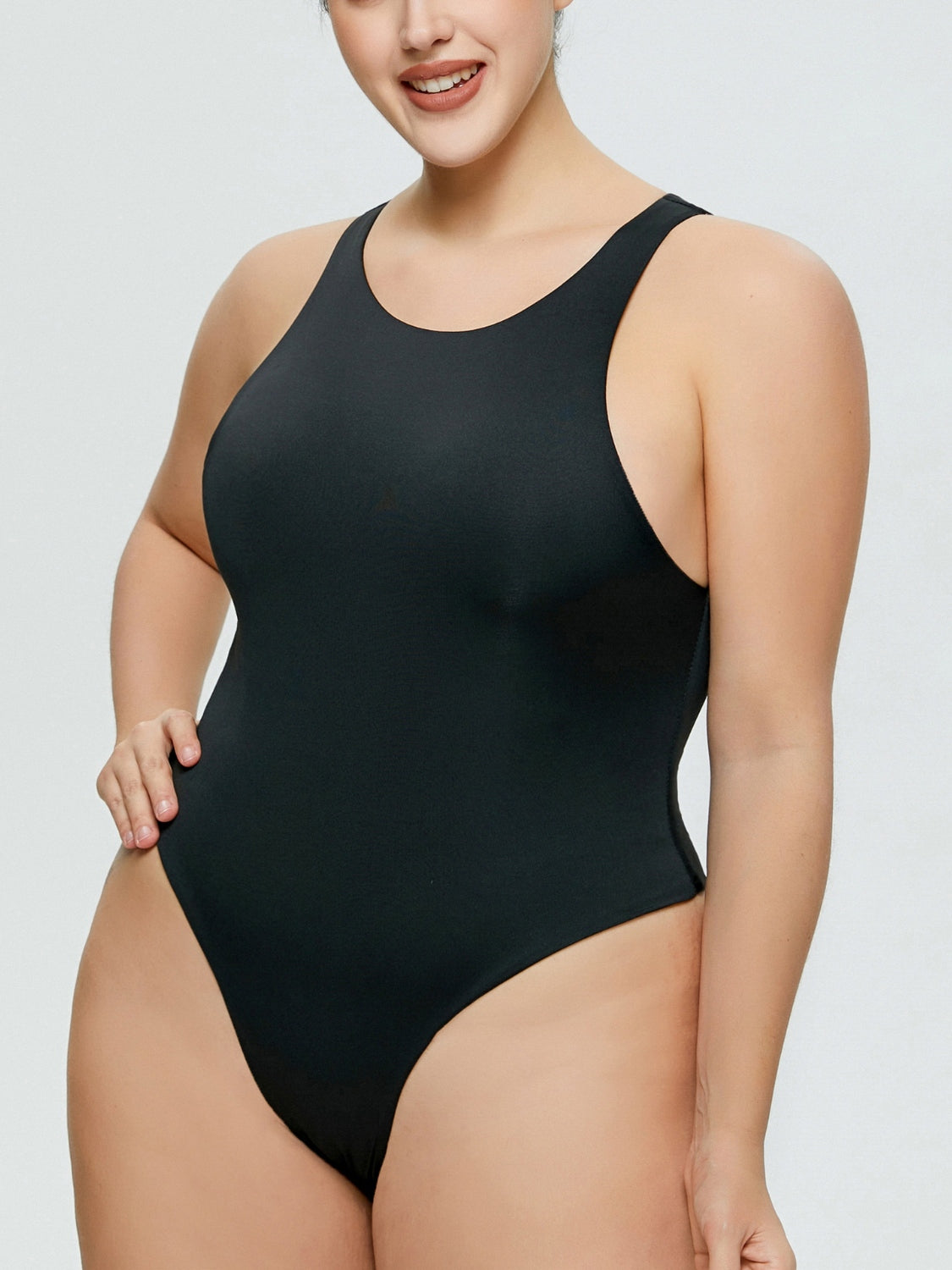 Black sculpted tank bodysuit with high-cut leg and racerback detail