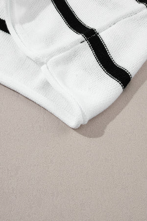 White knit shell top with black horizontal stripes and a textured knit detail.