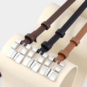 Slim cowhide leather belts in black, coffee brown, and brown with silver buckles.