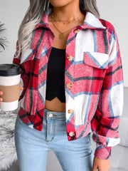 Oversized red plaid shacket with patch pockets and button front, worn with jeans.