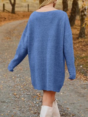 Blue ribbed knit oversized mini dress with long sleeves and a boat neck.