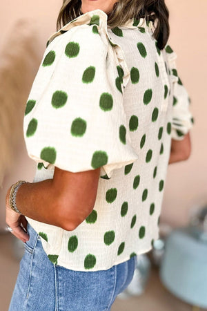 Textured polka dot blouse in matcha green with smocked yoke and puff sleeves.