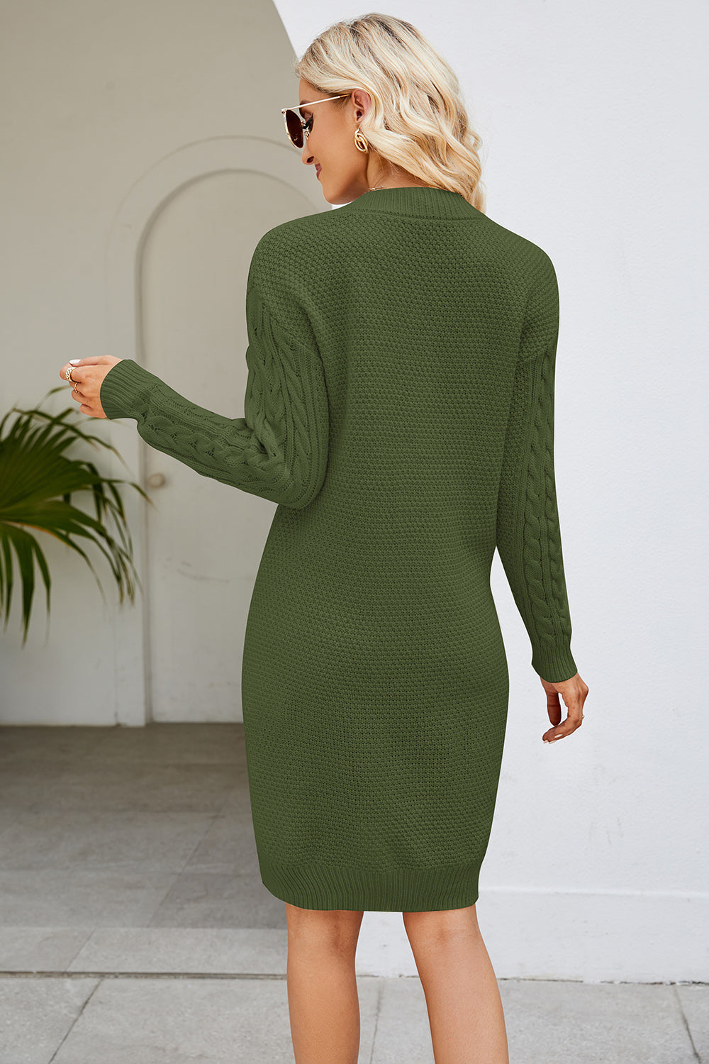 Cable knit bodycon mini dress in Matcha Green with cable sleeves and a textured knit.