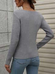 Gray ribbed knit top with scalloped neckline and cuffs, long sleeves.