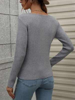 Gray ribbed knit top with scalloped neckline and cuffs, long sleeves.