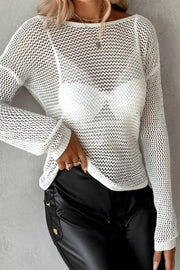 White crochet knit top with a boat neck and long sleeves, layered over a white bra.