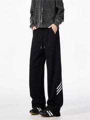Black relaxed fit sweatpants with drawstring and side stripe detail