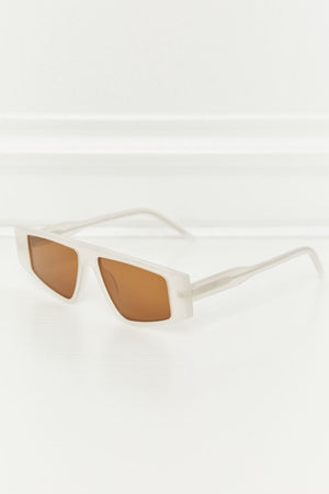 Angular acetate rectangle sunglasses in caramel with brown lenses and a frosted finish.