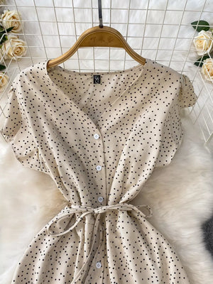 Apricot polka dot maxi dress with belt, button front, V-neck, short sleeves.