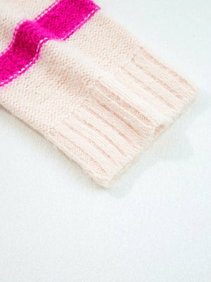 Pink acrylic knit sweater with bold fuchsia stripes and ribbed cuff detail.