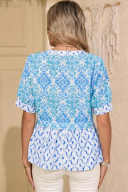 Patchwork babydoll maternity overshirt with puff sleeves in blue and white ikat print.