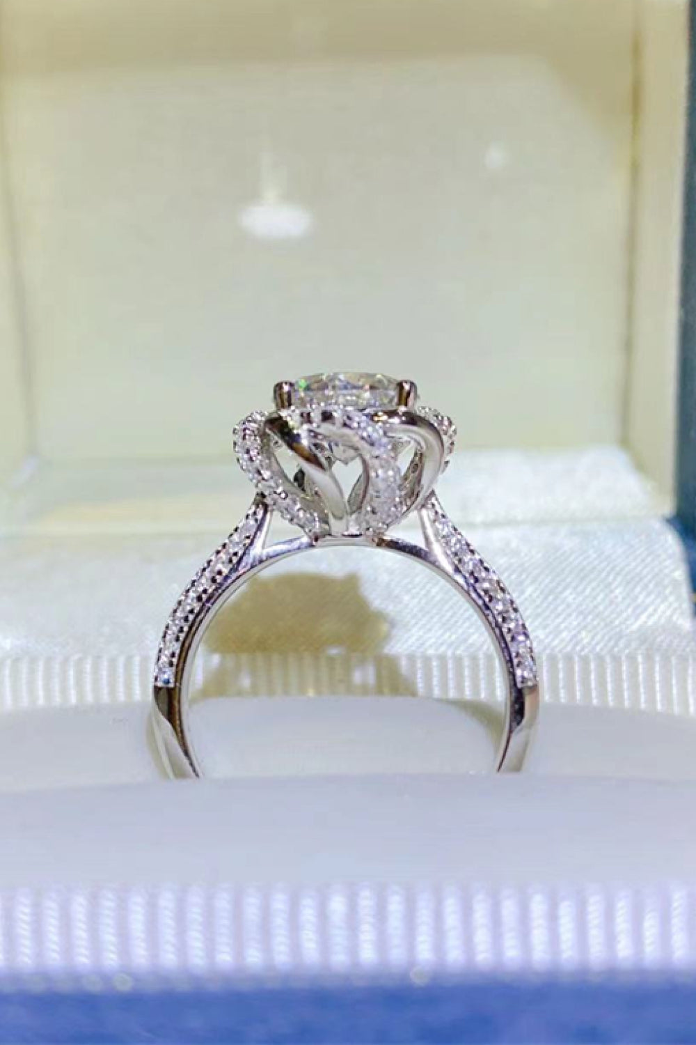 Silver halo moissanite engagement ring with pave band