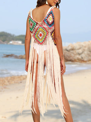 Crochet patchwork cover-up dress in cream with colorful squares and long fringe detail.