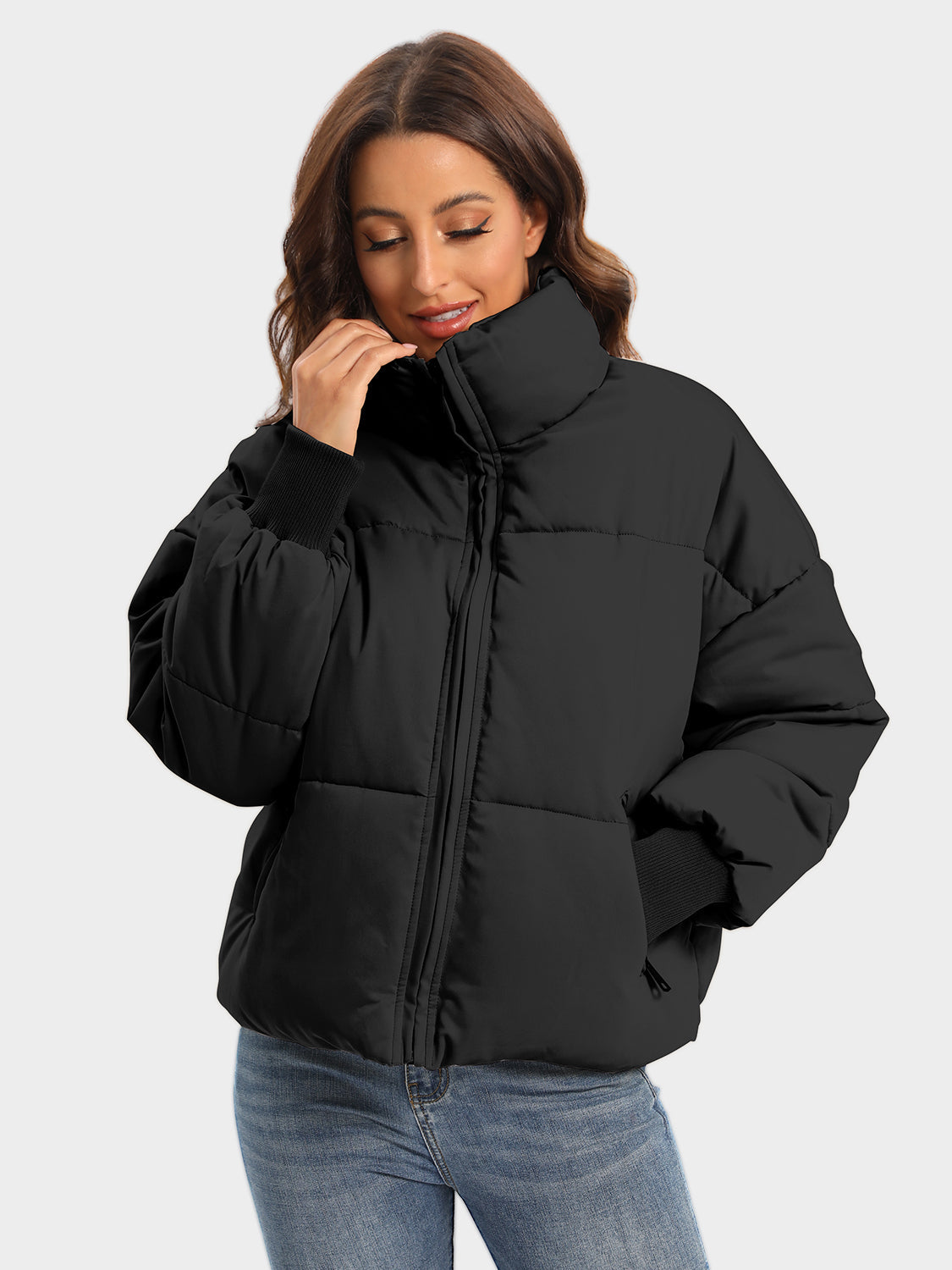 Black padded bomber jacket with high neck and ribbed cuffs.