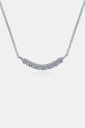 Silver moissanite necklace with a curved row of sparkling stones on a delicate chain.