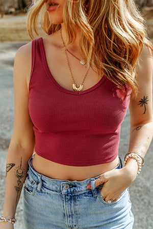 Ribbed rust crop tank top with subtle scoop neckline and sleeveless cut.