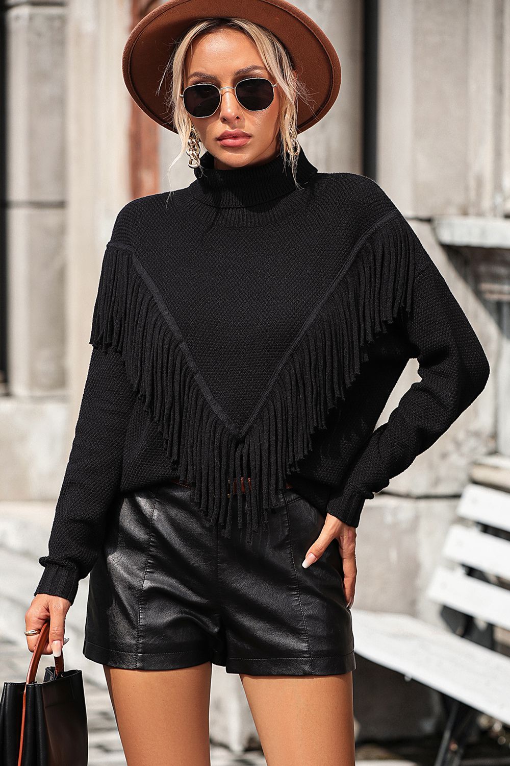 Black fringed chevron knit turtleneck sweater with a V-neck detail.