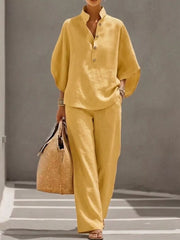 Yellow button-down loungewear set with wide sleeves and relaxed fit pants.