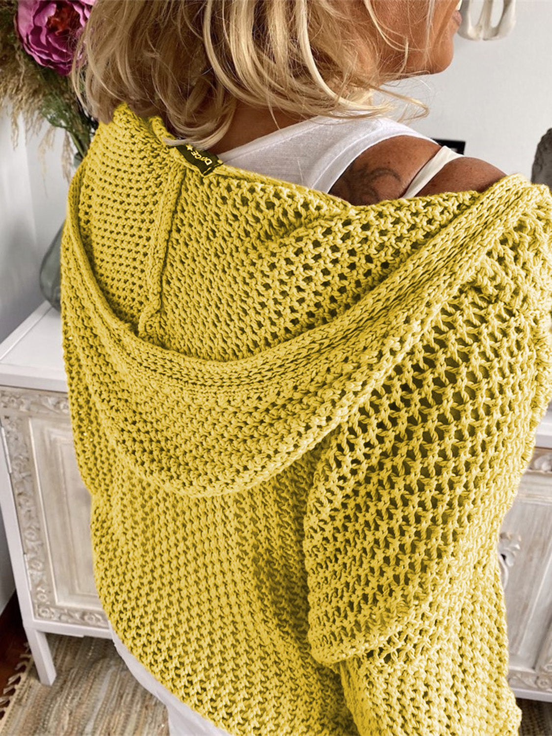 Yellow open-knit slouchy hooded sweater with a relaxed fit.