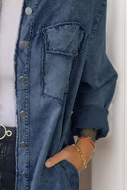 Oversized denim shirt jacket in dark gray with buttoned front and chest pocket detail.