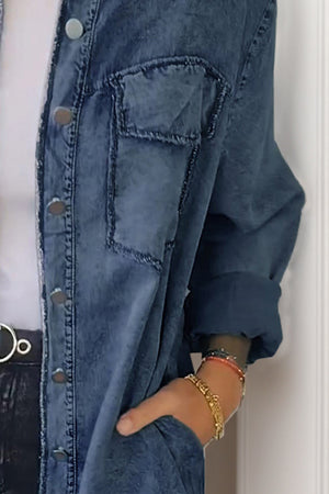 Oversized denim shirt jacket in dark gray with buttoned front and chest pocket detail.