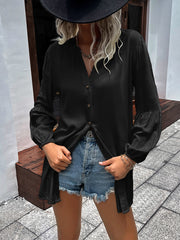 Black oversized blouse with Mandarin collar, button front, and balloon sleeves.