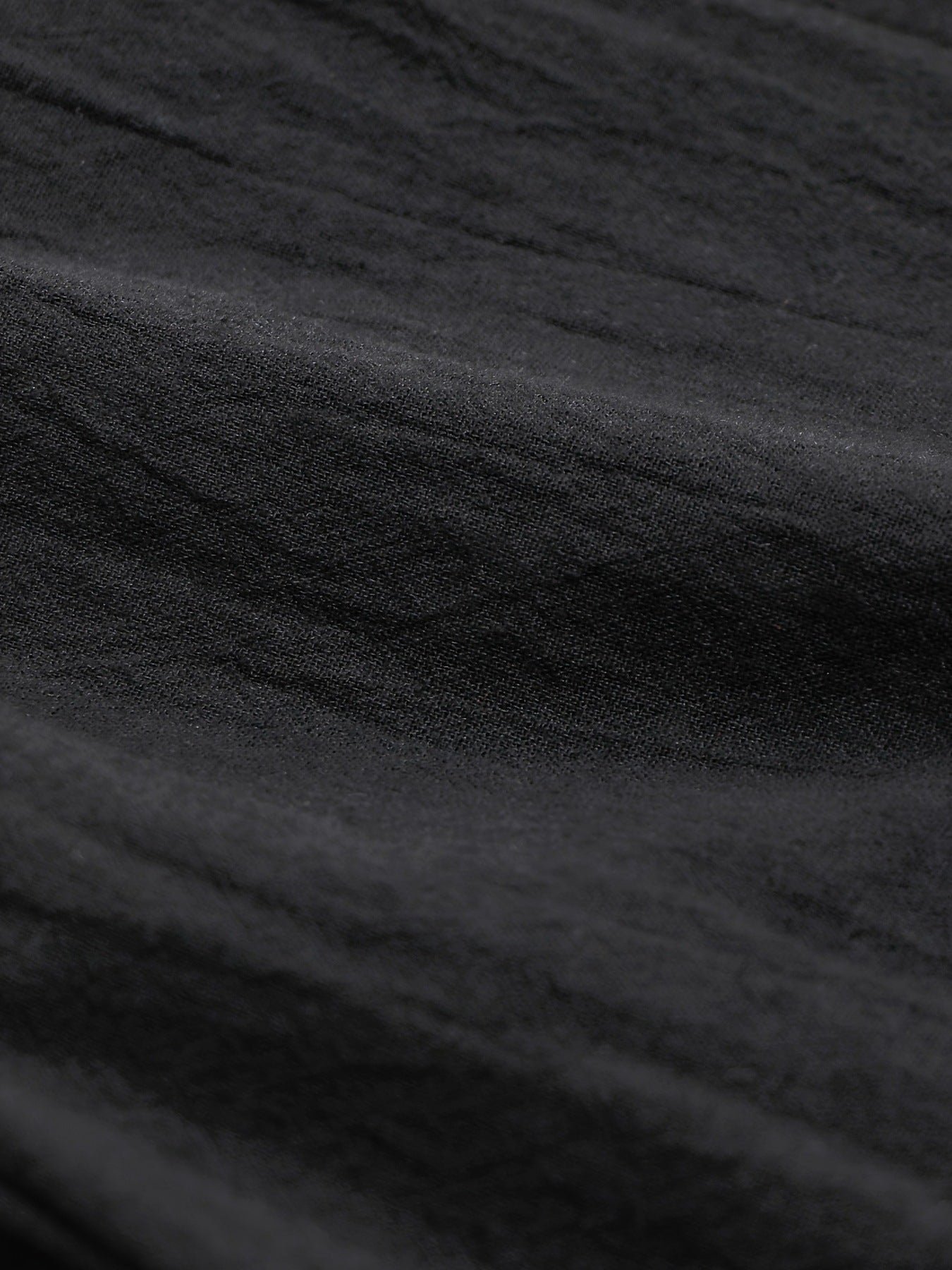 Black relaxed fit wide-leg pants with textured fabric detail