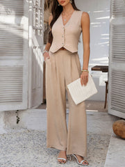 Tan textured crop vest with button detail and wide leg pants.