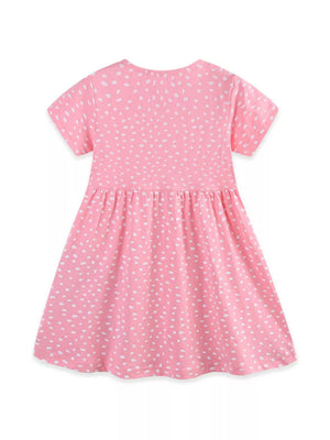 Baby girls pink cotton dress with white speckle print and short sleeves.